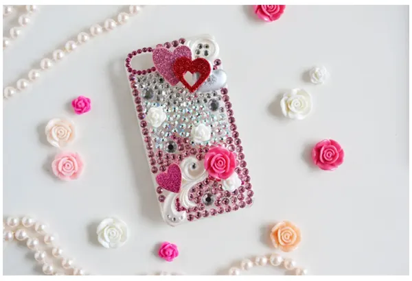 A phone case decorated with jewelry pieces
